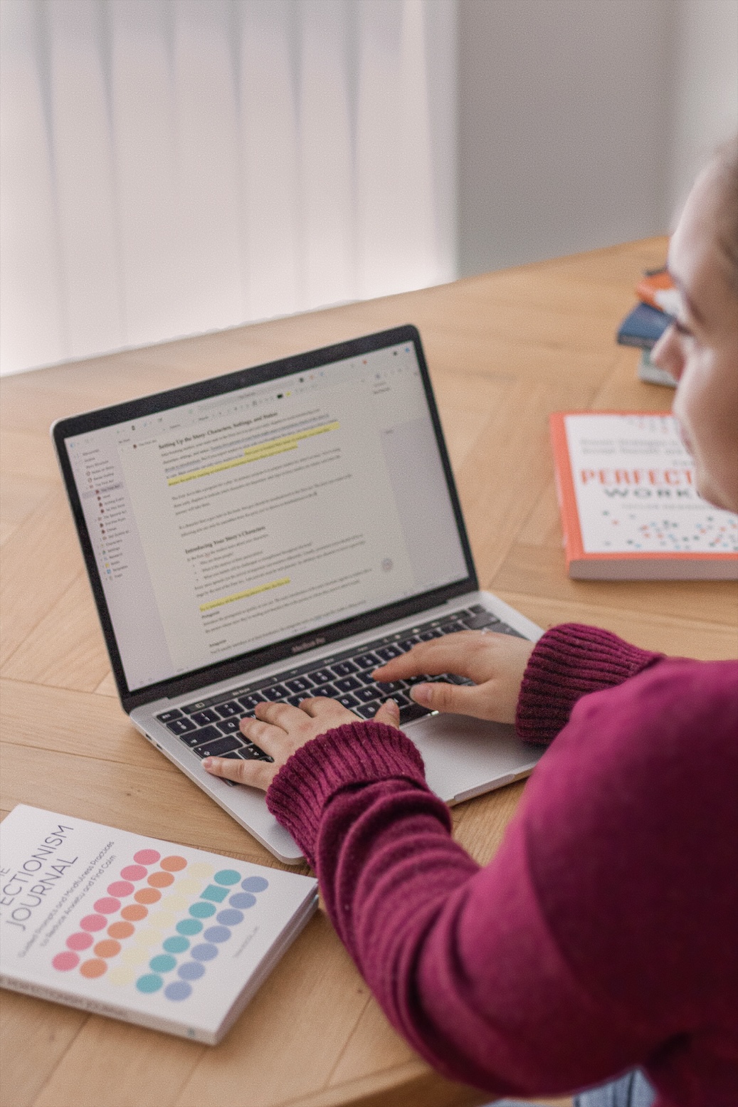 Close-up of a woman typing on a laptop, used as the category image for writing-related posts on the homepage.